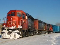 During the winter of 2008 a westbound is rounding a curve in the St-Henri neighbourhood of Montreal with a lashup impossible to replicate today out on the road (as the 6000's are now in hump service): SD40U CN 6028, Dash8-40CM CN 2447 & GP9 CN 7075. The train may be CN 323, returning from St. Albans, VT. 