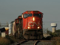 Driving back from work, a break off the 401 finds me at Milton again on CN. This train, CN 383, is a pretty reliable one as it usually comes just after 18:00. Today I must say I was a little elated to see that an SD75i was leading. Most of the time, I've been seeing GE locomotives, so this is a nice change. Thank you for the inspiration Marcus :) It was worth the hike. I think the path made was by you!