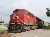 With CP 8955 & 9583 at the front, the mixed freight slowly ascends from Wolverton yard on their journey west. Seen at the HWY#3 crossing to the N of the village.