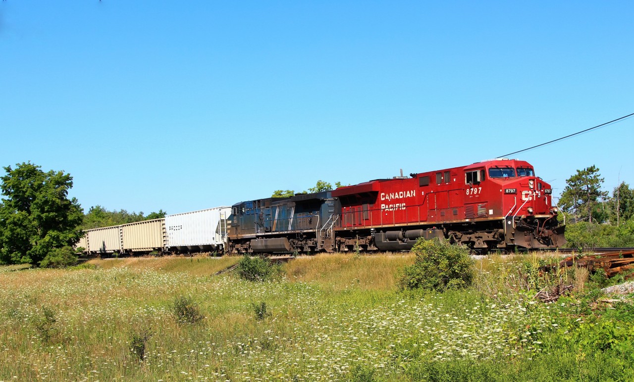 After working its way up the Hamilton sub, CP 247 led by CP 8797 with CEFX 1055 for added power, work their way up to the Canyon Road crossing and MM37 on the Galt sub.