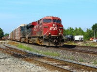 CP 8833 with CEFX 1042 lead the daily CP 234 through Guelph Junction cleared to Milton. OSR 181 and OSR 505 sit idling on the siding after just having pulled out of the shop. Ex-CP 1116 sits as a parts machine.