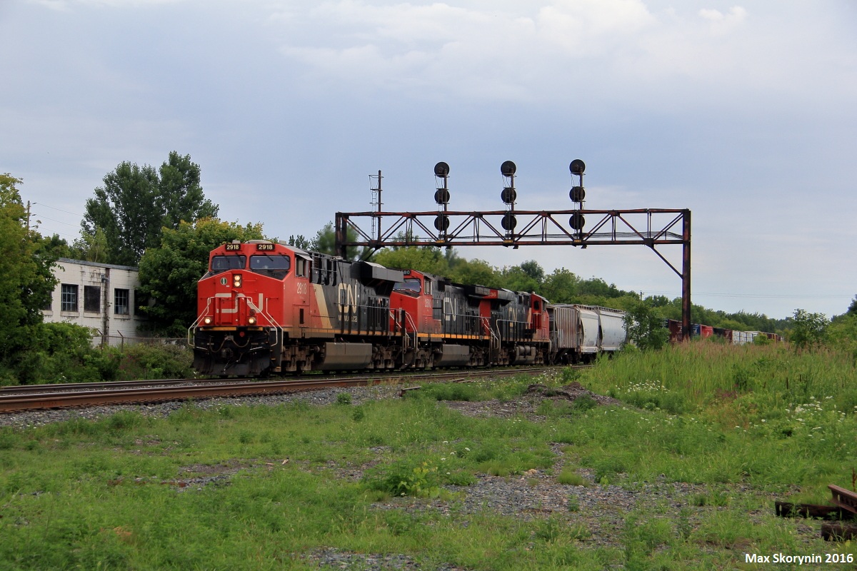 3 GEVO's bring Canadian National manifest M369 through CN Brighton making their way towards Toronto, with a pickup at Oshawa.