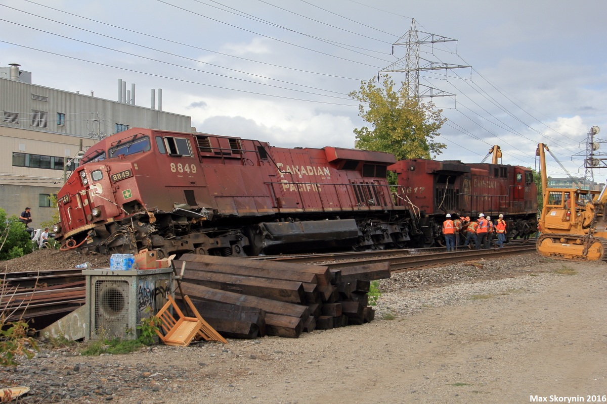 On Sunday, August 21st of 2016 Canadian Pacific train 235 collided with 118 at the Howland crossover in midtown Toronto just after 5am. CP 118 (taken away at time of the picture) was crossing over from the North to the South track at Howland crossover (the crossover pictured) while CP 235 was running light power (the 2 engines pictured) from CP's Toronto Agincourt yard to either Spence Yard on the MacTier Subdivsion or straight to Lambton Yard on the Galt Subdivision to pick up their train and proceed west. The rumor is that CP 235 was not paying attention to their signals and came around the corner barreling at Howland at upwards of 50mph, ran the red block and side swiped the last 18 cars of 118's train in the crossover. The results, a shaken up however okay crew, yet fired from further rail operations.