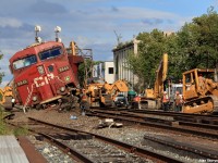On Sunday, August 21st of 2016 Canadian Pacific train 235 collided with 118 at the Howland crossover in midtown Toronto just after 5am. CP 118 (taken away at time of the picture) was crossing over from the North to the South track at Howland crossover (the crossover pictured) while CP 235 was running light power (the 2 engines pictured) from CP's Toronto Agincourt yard to either Spence Yard on the MacTier Subdivsion or straight to Lambton Yard on the Galt Subdivision to pick up their train and proceed west. The rumor is that CP 235 was not paying attention to their signals and came around the corner barreling at Howland at upwards of 50mph, ran the red block and side swiped the last 18 cars of 118's train in the crossover. The results, a shaken up however okay crew. I guess even the crossover's name correlates with the accident.  