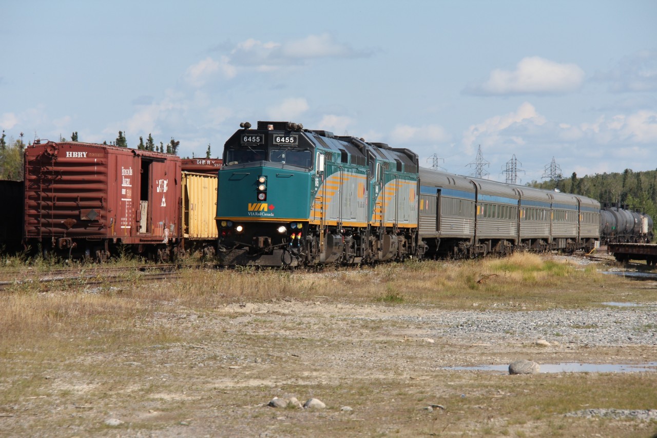 VIA #693, formerly known as the Hudson Bay, at Thompson, Manitoba. 

The train is actually make a reverse movement to reach the wye located just outside of town where all passenger trains are turned for their return trip along the Thompson Sub. 

Train time at Thompson can be a busy scene as both the north and south bound passenger trains are due in around the same time. On this day #693 arrived first and after detraining pulled past the station to the end of track to allow #690 access to the station platform. The southbound came and went first and after it had completed its wye movement it was the northbound's turn.  After the train pictured had been turned it will back to the depot and board passengers for the true remote stretch of the line north to Churchill. 

The three to four hour Thompson layover provides an excellent opportunity to take in some of the eclectic operations and equipment of the Hudson Bay Railway. This line is a true gem and by far the most interesting experience VIA offers. 

Also this photo is indeed level, it is the track that is off!
