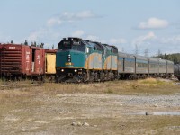 VIA #693, formerly known as the Hudson Bay, at Thompson, Manitoba. 

The train is actually make a reverse movement to reach the wye located just outside of town where all passenger trains are turned for their return trip along the Thompson Sub. 

Train time at Thompson can be a busy scene as both the north and south bound passenger trains are due in around the same time. On this day #693 arrived first and after detraining pulled past the station to the end of track to allow #690 access to the station platform. The southbound came and went first and after it had completed its wye movement it was the northbound's turn.  After the train pictured had been turned it will back to the depot and board passengers for the true remote stretch of the line north to Churchill. 

The three to four hour Thompson layover provides an excellent opportunity to take in some of the eclectic operations and equipment of the Hudson Bay Railway. This line is a true gem and by far the most interesting experience VIA offers. 

Also this photo is indeed level, it is the track that is off!