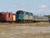 VIA #693, formerly known as the Hudson Bay, at Thompson, Manitoba. 

The train is actually make a reverse movement to reach the wye located just outside of town where all passenger trains are turned for their return trip along the Thompson Sub. 

Train time at Thompson can be a busy scene as both the north and south bound passenger trains are due in around the same time. On this day #693 arrived first and after detraining pulled past the station to the end of track to allow #690 access to the station platform. The southbound came and went first and after it had completed its wye movement it was the northbound's turn.  After the train pictured had been turned it will back to the depot and board passengers for the true remote stretch of the line north to Churchill. 

The three to four hour Thompson layover provides an excellent opportunity to take in some of the eclectic operations and equipment of the Hudson Bay Railway. This line is a true gem and by far the most interesting experience VIA offers. 

Also this photo is indeed level, it is the track that is off!