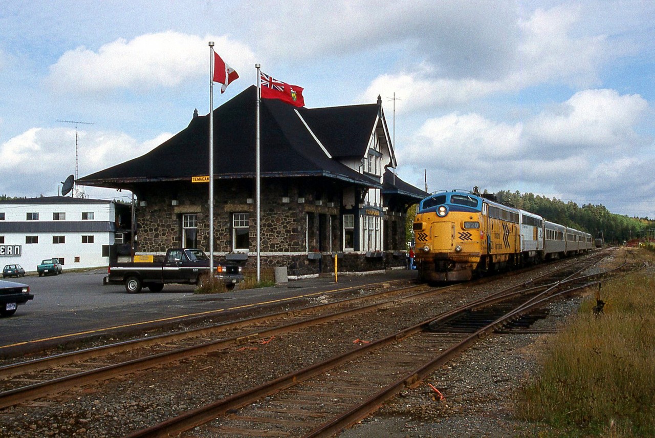 Ontario Northland's southbound Northlander is seen at the unique Temagami Station on September 28th, 1993. Powering the train is FP7 1520, followed by an old B-unit converted to a HEP car, and 4 former GO Transit single level cars. Unfortunately, this neat little passenger train no longer operates.