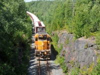 308 passing through a rock cut outside of Swastika with SD40-2 1730 leading 17 cars