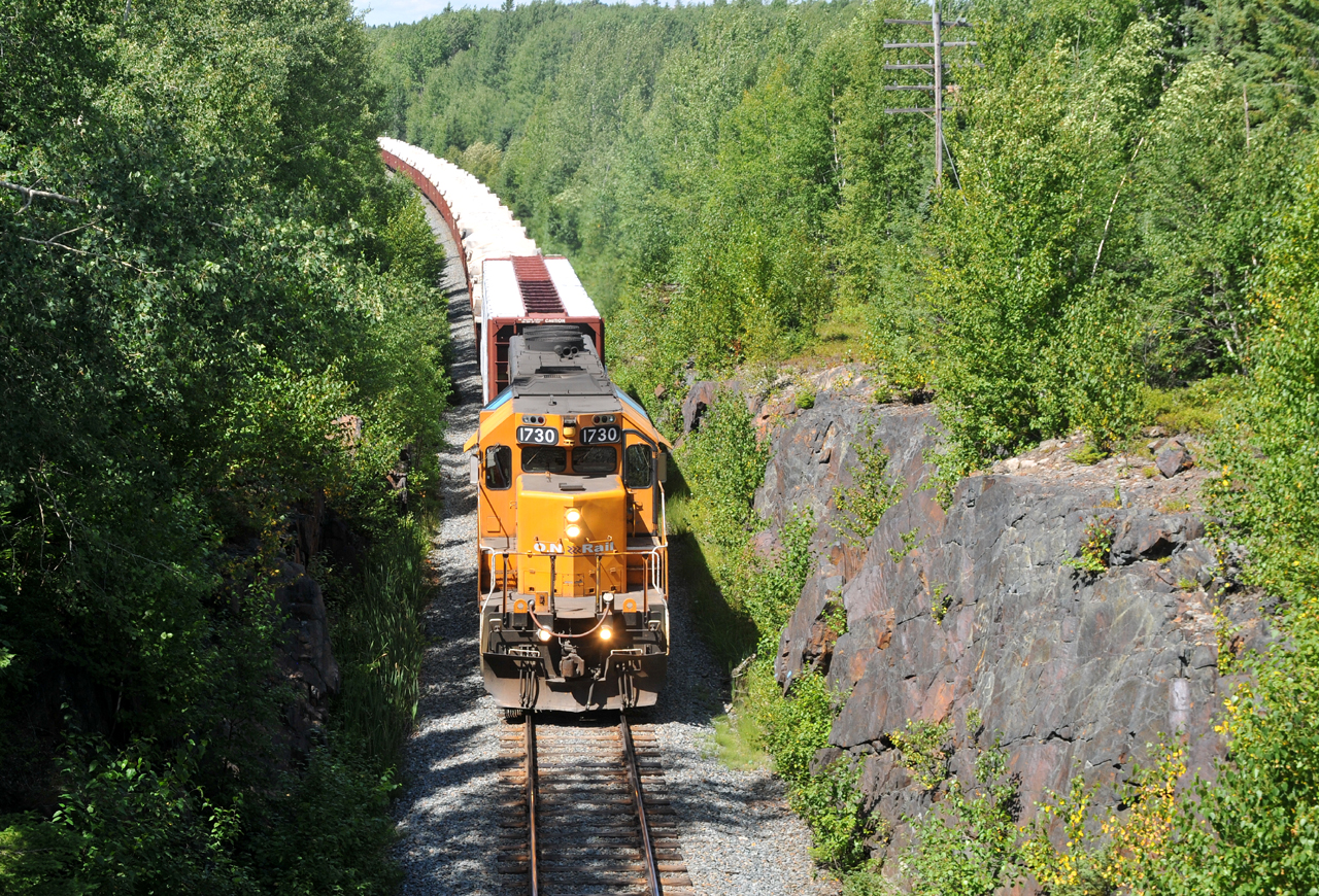 308 passing through a rock cut outside of Swastika with SD40-2 1730 leading 17 cars