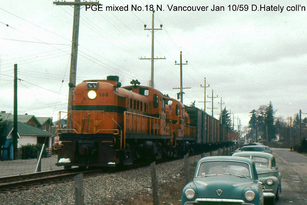 PGE Mixed train M18 from Lillooet is seen arriving at North Vancouver January 10, 1959. All of the 28 stations were regular or flag stops for M18 except Creekside. The 158 mile trip took 8 hours and 20 minutes for an average speed of 19 mph. This is a slide I traded for many years ago and did not record the photographer's name.