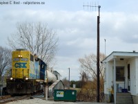 1225 James St, Wallaceburg. While many photographers focused on the bridge with the C&O Markings (Still there to this very day) I took a couple opportunities to record the north side of the bridge from James St. The cinder block building at right is the Wallaceburg RTC office - the smallest dispatching office in the CSX network. In 1996 CSX closed the St. Thomas division office and moved the RTC's to 1225 James St. But it was always the Bridgetender's building, and until 2013 a Bridgetender would have to come down from Sarnia to line the bridge when a train operated, as the RTC's did not have this in their collective agreements hence did not operate the swing bridge. (Note: The Bridgetender would use A mechanism inside the building, akin to a large safe with dials  to operate the bridge).<br>RTC's were on duty 24 hours a day, 7 days a week, and when this photo was taken only 2-3 trains a week operated into the OCS requiring a clearance. Prior to 2006 the usual number was about 4 to 6 movements a day, and in 1996 probably up to 8 to 10 with the majority being on the Chatham-Fargo segment of the CSX <br><br>The RTC's radio tower is clearly seen at centre, and D724 is crossing the swing bridge at left. The RTC office was abolished at the end of October 2013 and by this time CSX had already reduced it from 24/7 to running on days the trains were scheduled to run.<br><br><b>*BONUS* </b>Let me bring you into the RTC's office with some radio recordings from 2005 and 2006</b><Br><a href=http://steve.hostovsky.com/clearance_south_sarnia_mile_25.mp3 target=_blank>Clearance to near Chatham</a><br><a href=http://steve.hostovsky.com/chatham07152005.mp3 target=_blank>Chatter between D725 and the Chatham Depot, with a call to the RTC to clear North Chatham</a><br><a href=http://steve.hostovsky.com/work2613southchatham.mp3 target=_blank>Work 2613 clear south chatham and OK for rule 105 at Blenheim</a><br><br>If you enjoy this - hit the star :) Also hoping  to encourage some kind soul to dig out some CSX/Chessie/C&O photos - too much CN and CP lately here :) There are other Class 1's that operated in Canada! Cheers.