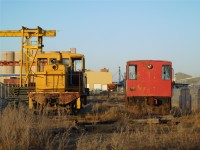 A pair of very old GE locomotives in indefinite storage in Winnipeg. The yellow one is a GE 50T built in May of 1947, and the red one is a Canada Cement GE 15T built in April of 1955. They are in pretty poor condition, and I imagine they are both inoperable. The yellow unit has moved in the last 10 years, but not under its own power, just being moved from one place to another in Winnipeg. They are both on rails, and connected to an active rail line. They are at the very end of a section of industrial spur tracks.