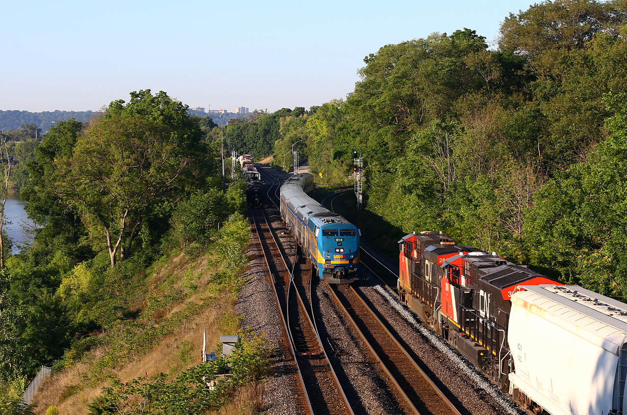 Triple play at Bayview: CN 385 heads down track one for the Dundas Sub while VIA 82 rolls off of the south track of the Dundas, now with an all-Budd consist. Meanwhile, 421 has stopped to work Stuart street yard in Hamilton, and his tail end sits in the plant at Bayview. Note that MOW crews have been working on track one recently, with new rail installed, new ballast, and new ties not yet installed (piled on north side if the tracks).