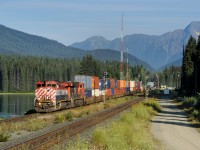 A sparkling BCOL C44-9WL 4644 leads train Q102 through Redpass on a pristine morning alongside the Fraser River.