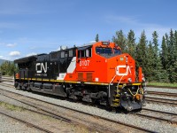 Brand new CN ET44AC 3107 sits quietly in the yard at Swan Landing after bringing a loaded sand train in earlier in the morning. This was one of the first "3100s" to be built, and the first one to enter Canada.