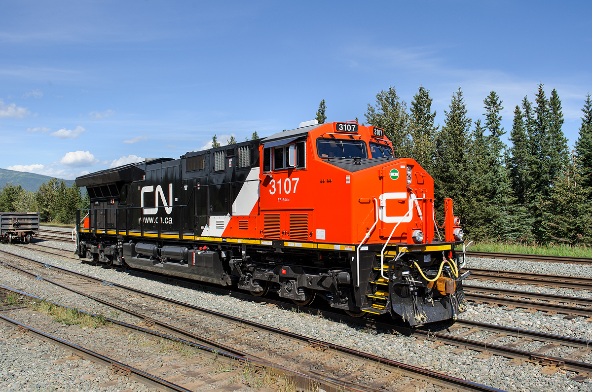 Brand new CN ET44AC 3107 sits quietly in the yard at Swan Landing after bringing a loaded sand train in earlier in the morning. This was one of the first "3100s" to be built, and the first one to enter Canada.