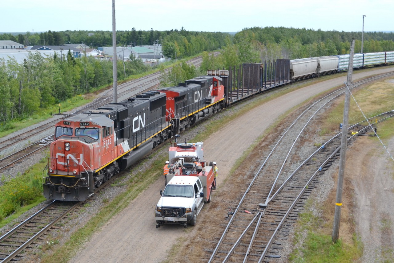 CN train 407 backs second half of it's train into CN Gordon Yard after coming in from Halifax, and MOW crew gets set to fix 1 of the Switches at the top end of the yard.