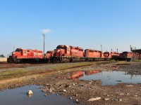 On this evening GP9 1533 is in the clear after some switching around by a shop crew on track 4 east ahead of stored SD40-2 5978. On track 2 sit more stored SD40-2's 6017 6080 6012 and SD40-2F 9001. ES44AC 8702 and AC4400 9627 take up track 1 east.