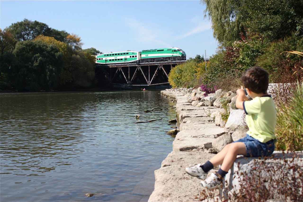 Growing up, Canadian National's Oakville subdivision was the only rail line I knew much about. Considering the variety of traffic that ran over the line, I didn't need much more. CN had a few through freights along with locals traveling the entire subdivision, CP traveled using trackage rights. Then there was the passenger trains, single and bi-level GO trains along with a mix of VIA trains and a pair of Amtrak trains. That was the 1980s and 1990s. Today Metrolinx owns the line and most of the freight traffic has bee re-routed elsewhere leaving little excitement on line for me. My son on the other hand has found the excitement I once had for the line and has taught me to find new photo opportunities for a line that once held so many. The Credit River bridge has long been a favourite location of mine and now the torch has been passed.