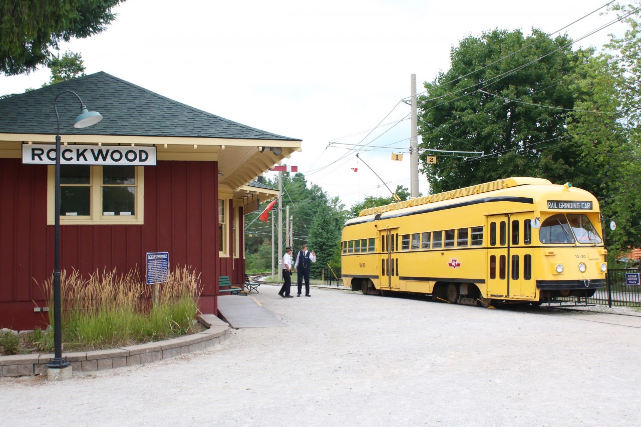 Streetcar W-30 is an interesting car in that it came from Cleveland's  transit company. It was used by the TTC as a rail grinder and the Halton Radial installed the seats back in it so it can be used for the tourist operation.  The car has just returned from the last run of the day and sits beside the relocated CNR Rockwood station.