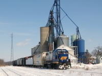 For the <b><a href=http://www.railpictures.ca/time-machine target=_blank>Time Machine</b></a> RLK 3873 is the selected power this day for SOR's short lived daily switching service to customers Hagersville north along the line to and including Caledonia.  SOR 595X is just returning to Hagersville from a light run to Caledonia on a clear, sunny winter's afternoon. These week-day treks provided a most enjoyable day light chase providing many differing photo opportunities. RLK 3873 in clean livery is seen easing upgrade past the former Hagersville Elevators combining for a nice local winter scene. I would like to enter this photo into the "Time Machine"  challenge to be partnered with the 1986 photo, of the CP powered steel train (6 month) at the exact same location, submitted by John Eull. Note the addition of the lattice tower, Haldimand-Norfolk water tower (green) and 3 in-a-row blue load-out bins.  The white office depot peaking around from behind the lead power in each photo is no longer part of the facility due to a suspicious fire. John's companion photo is <a href=http://www.railpictures.ca/?attachment_id=4863 target=_blank>http://www.railpictures.ca/?attachment_id=4863   </a>   