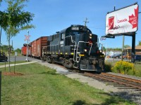 
What does a School Crossing Guard do on a ‘PD’ or Professional Activity Day?  If a raifan, seize the opportunity to take a trackside ‘Photo Day’ of course! While chasing the Trillium Railway’s Friday solo powered freight northbound from Dain City on the Canal and Thorold Spurs to Merritton, I observed several intriguing trackage configerations, couple of neat switching moves and an abundance of Seaway traffic on the Welland Canal.  The most time consuming and complex move of the day goes to the tick-tack-toe 4-point switching maneuver required to cross the double tracked Grimsby Sub both northbound from Thorold to Merriton & St Catharines and then vice-versa when southbound back home to Dain City.  The “PD’ or photo of day goes to Ontario’s Trillium 1859 and four clean box cars parading diagonally and boldly across Merritt & Seymour to pose briefly with Tim Horton’s impressive Canadian, Maple-leaf billboard.  I can’t think of a more fitting image for a proud Canuk coffee loving railfan from Ontario enjoying a sunny, trackside ‘PD’ holiday? 

KUDOS to Trillium Railway Co. LTD., a short line railway founded in 1997, currently operate the Port Colborne Harbour Railway (PCHR) serving 19 customers on its 50KM long network located in the Niagara Region providing interchange with both CN and CPR. 
   
