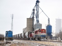 RLK 4057 and stable-mate NECR 3840 slowly climb upgrade  past the then idle elevators through Hagersville with one of several wind turbine trains destined for SOR's Franklin Yard further south near Nanticoke, ON.  Franklin Yard is located on the US Steel spur just off of Concession 3 and served as a temporary, convenient trans load site for local wind turbine units rail to truck.  CEFX 2019 sits parked for the moment on siding HD 34. 

Additionally I would like to enter this photo into the 'Time Machine' challenge as a companion photo to my 2011 photo http://www.railpictures.ca/?attachment_id=26075 and moreover partnered with the original photo submitted by John Eull http://www.railpictures.ca/?attachment_id=4863 of 1986.  The office / depot was smoked between photos and the water tower repainted white with a blue base.  The 'Time Machine' challenge provides an opportune and interesting comparison.  