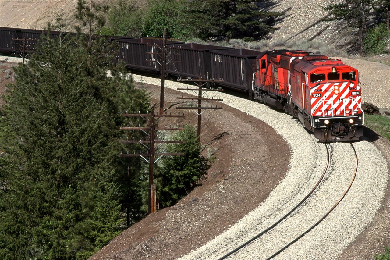 A cowled SD40F leads this westbound coal load train around a curve in White Canyon, just east of Lytton.