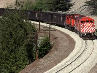 A cowled SD40F leads this westbound coal load train around a curve in White Canyon, just east of Lytton.