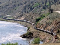 This is probably train 218, based on the auto racks and tank cars in the consist.It is working uphill along the Thompson River, upstream of Spences Bridge.