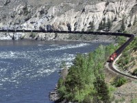 A loaded coal train, bound for Roberts Bank outside Vancouver swings through a big curve along the Thompson River. This is a few miles east of Spences Bridge.
Those hoppers don't look that full, though.