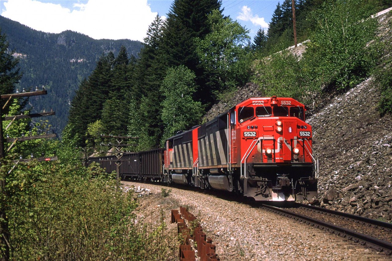 A loaded coal train, led by a couple SD60F's  runs just below the highway in the vicinity of Alexandra Bridge.