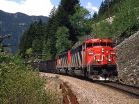 A loaded coal train, led by a couple SD60F's  runs just below the highway in the vicinity of Alexandra Bridge.