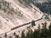 A mixed train, possibly #217, treads gingerly along the bench cut into the poorly consolidated sediments in the eastern end of White Canyon. This must be a very expensive piece of RR to maintain.
