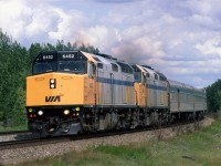 The westbound "Canadian" rounds the second large curve around Mink Lake at Carvell. 