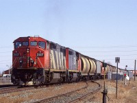 A loaded grain train arrives at Edmonton. I don't know whether it came off the Camrose Sub or Wainwright Sub (Trackside Guide indicates that it ran Edmonton to Vancouver).
If one looks carefully, the lead unit from the first batch of such locomotives seems to have more sag than the second unit - from the second batch purchased.