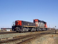 This power set looks like it has spend some time working the Inland Cement plant in west Edmonton. The dust almost makes it look like the trucks are painted silver, like Sante Fe RR.