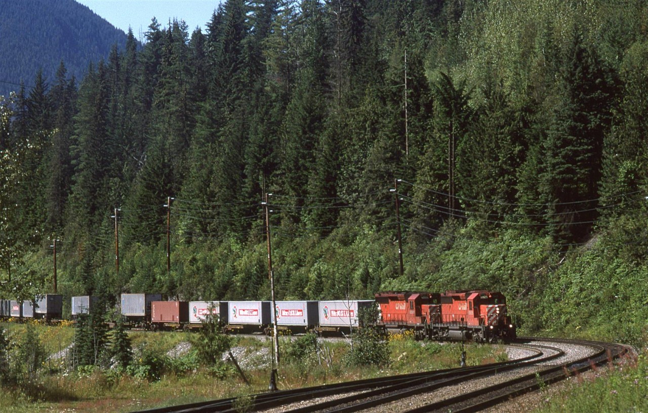 A eastbound COFC train works upgrade on Rogers Pass west slope.