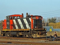 Her name was Bridgette, if memory serves correctly, and she was often seen working around Oakville Yard back in those days. In this shot she is captured giving her all at throwing a switch while 1422 patiently waits in the background. 