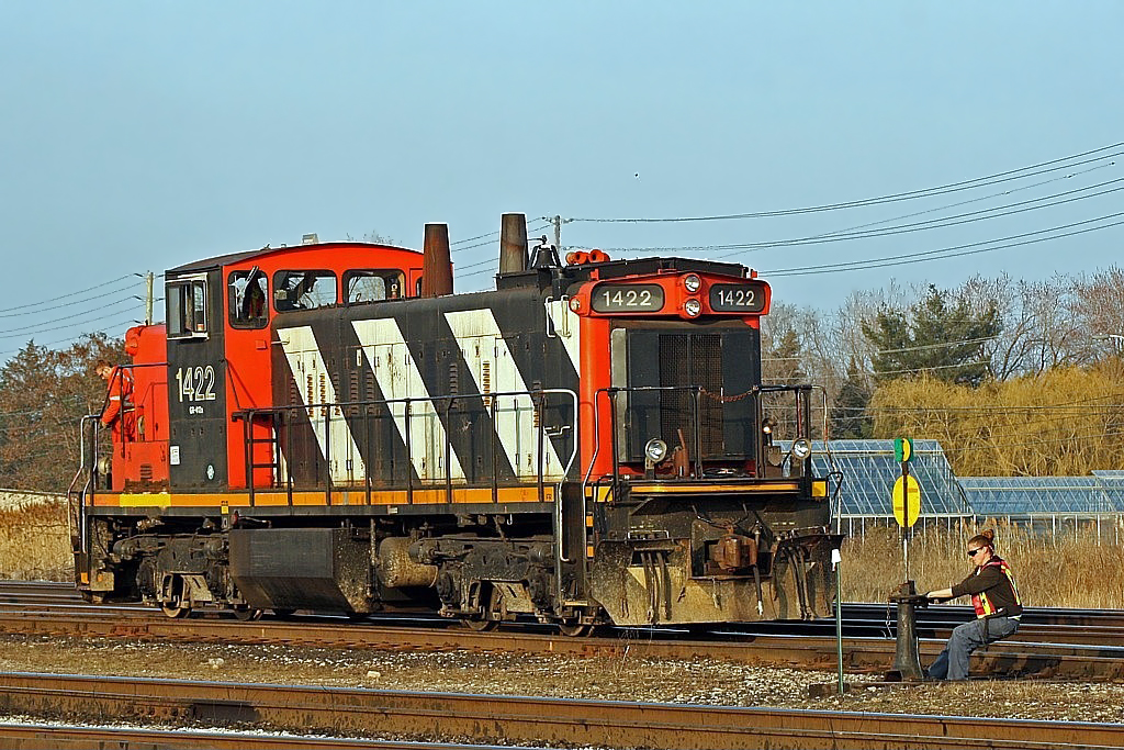 Her name was Bridgette, if memory serves correctly, and she was often seen working around Oakville Yard back in those days. In this shot she is captured giving her all at throwing a switch while 1422 patiently waits in the background.