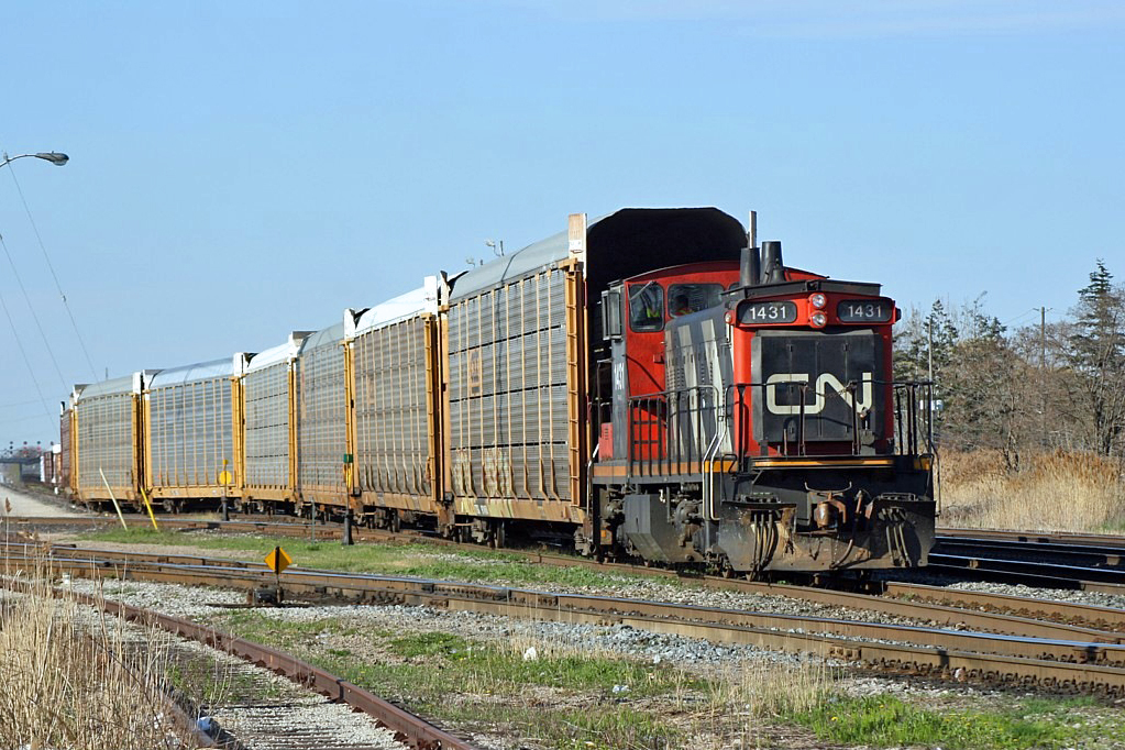 The GMD1 was my favorite type of locomotive, probably because it was old and gnarly like me, and although 1422 was my favorite of the class it certainly wasn't the only one I ever shot. Witness 1431 as it grabs a cut of empty 'racks to take up to the Ford auto loading facility as the grass begins to green up in the spring of 2007.