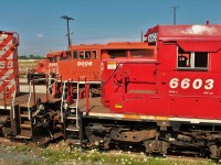 Stumbled across this view one day and just had to photograph it. Two ex SOO LINE SD40-2 cabs sandwich a red barn at the east end of repair shop 2.