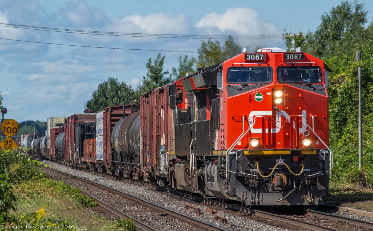 CN 368 comes through Dorval with CN 3087 leading the way.

CN 3087 marks the 1000th locomotive built at GE's Fort Worth plant in Texas.

CN 3087 & CN 3011