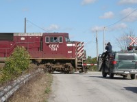 Somewhere near Welland, ON in the Niagara Region. CP led by CEFX 104 towards the border. Railfan on top his vehicle. I don't know...