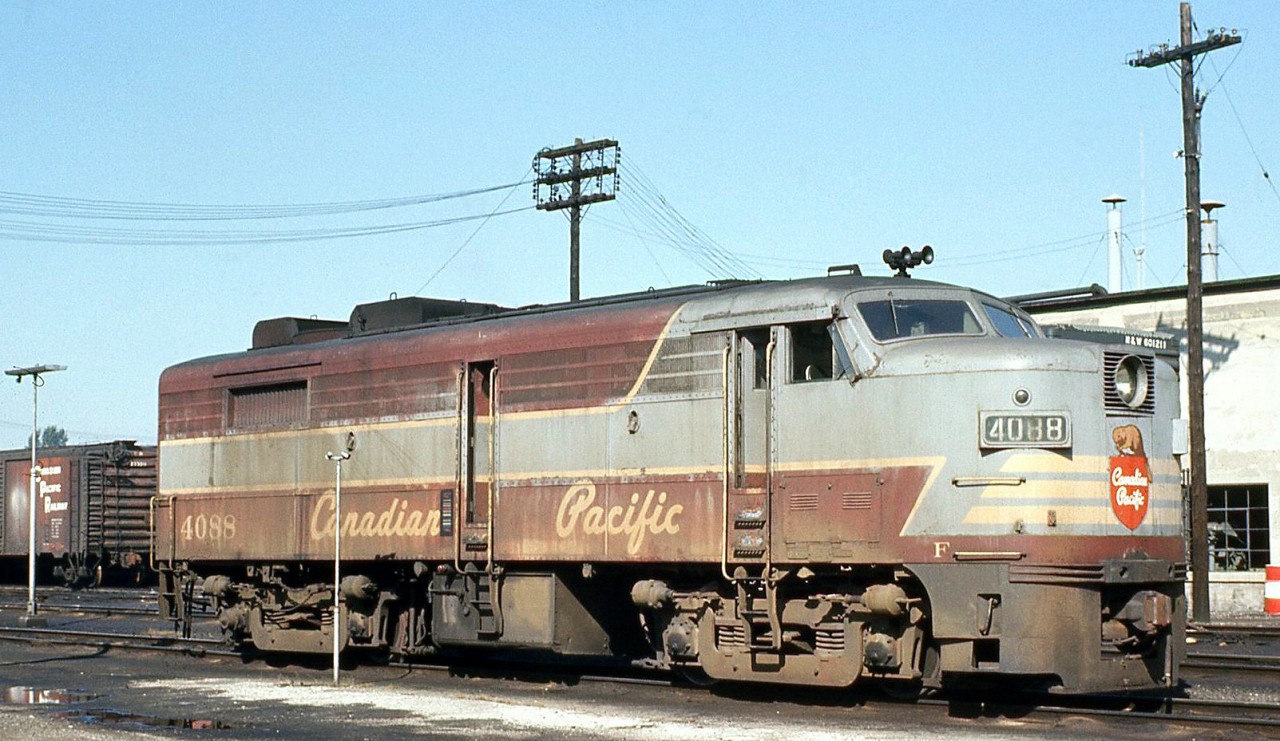 Sporting well worn maroon and grey script paint 5 years into the "action red" era, CP FA2 4088 sits at the Quebec Street shop in London ON awaiting its next assignment in October 1972.

Part of one of CP's few early orders for mainline diesels in the early 1950's, 4088 would recieve a new coat of paint next year, but would only last a few more years in service before being stored at St. Luc with much of the CP FA/FB fleet in 1975, and officially retired in 1977.