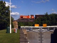 1945-built CP Rail Alco S2 7028 crosses above the Rideau Canal locks at Smiths Falls Ontario, around Mile 1 of the CP Brockville Sub, returning from Brockville.