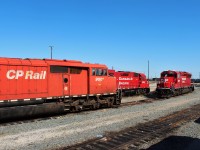 Red barn SD40-2F meets SD30ECO 5043 at the east end of the shop tracks.