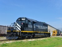 <b>A freshly repainted SD40.</b> VLSX 5232 may be the only 'straight' ex-CN SD40 still in service. It was repainted out of its faded zebra stripes during the past couple of months and sports a paint scheme very similar to that worn by SD40's on the New Brunswick East Coast not too long ago. Here it sits in the morning sun in the small Prairie Dog Central yard at Inkster Junction. Steam from 4-4-0 PDC 3 is visible in the background, it will leave with an excursion train in not too long, with passengers arriving to board the train.