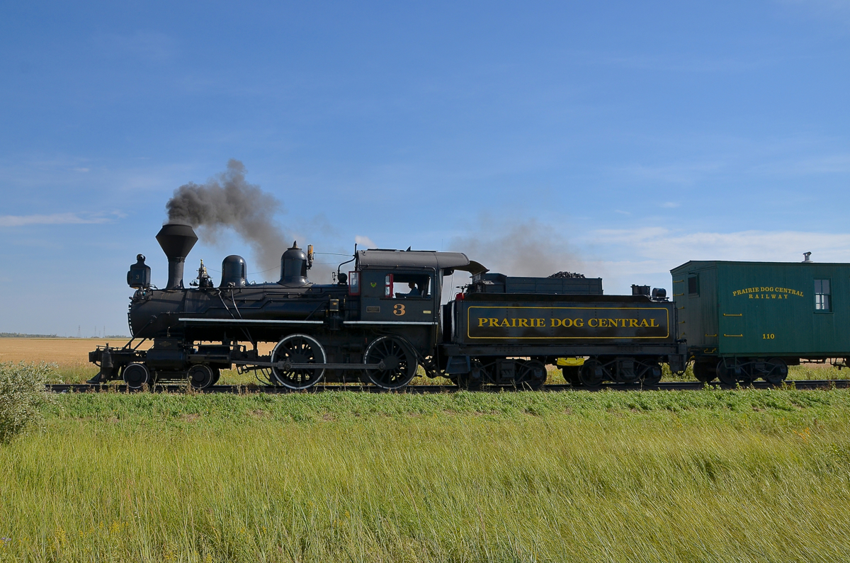 Steam over the prairies. PDC 3 is leading the Prairie Dog Central's 11 AM departure from Inkster Junction as it heads northwest. PDC 3 was built in Glasgow by Dübs & Company for the Canadian Pacific Railway, its first number was CP 22.